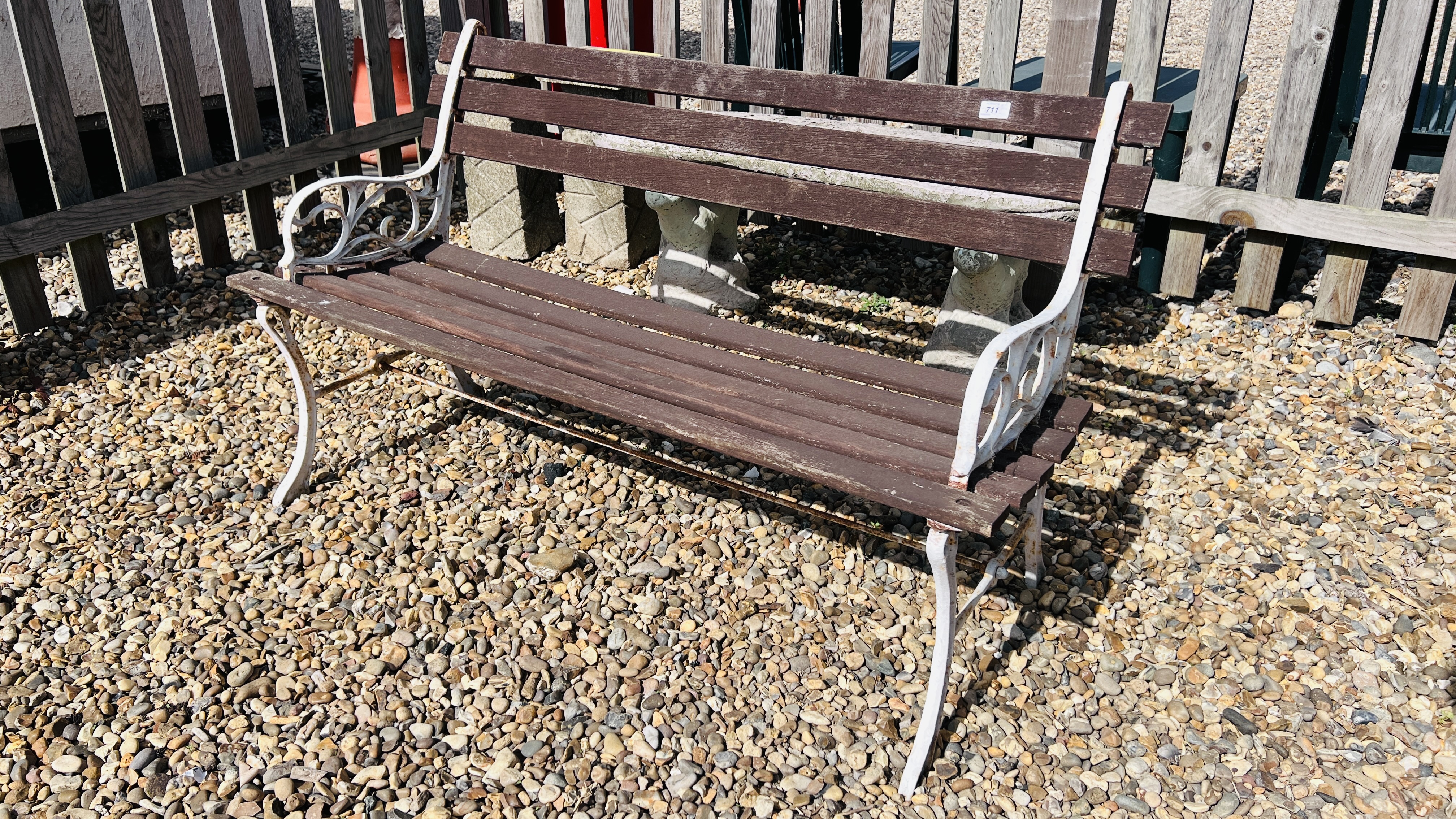 A CAST METAL END GARDEN BENCH