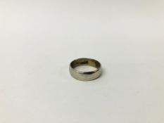 A WEDDING BAND MARKED PLATINUM.