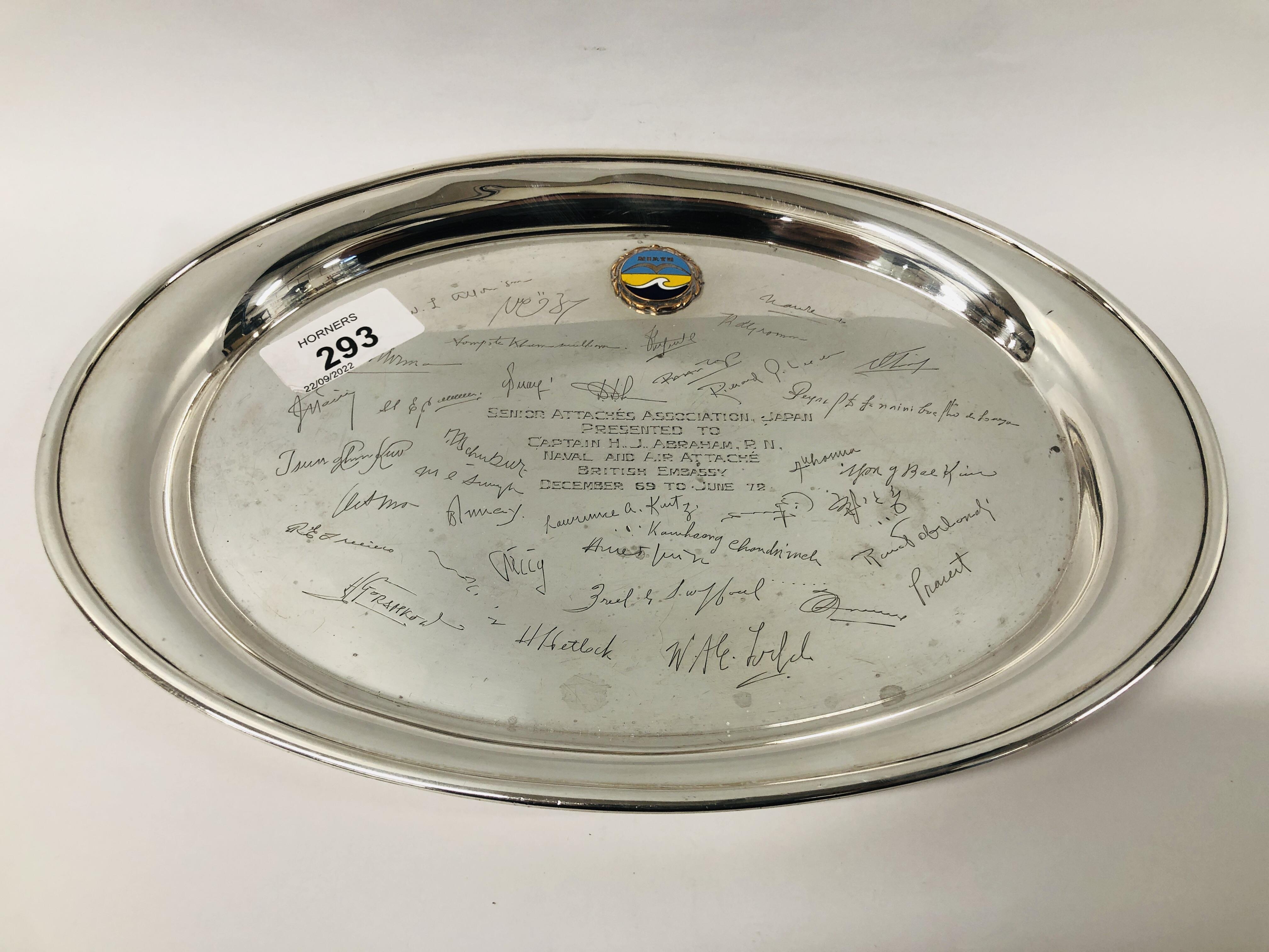 A STERLING SILVER OVAL TRAY WITH PRESENTATION INSCRIPTION AND SIGNATURES.