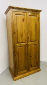 A HONEY PINE DOUBLE WARDROBE WIDTH 95CM. DEPTH 57CM. HEIGHT 186CM.