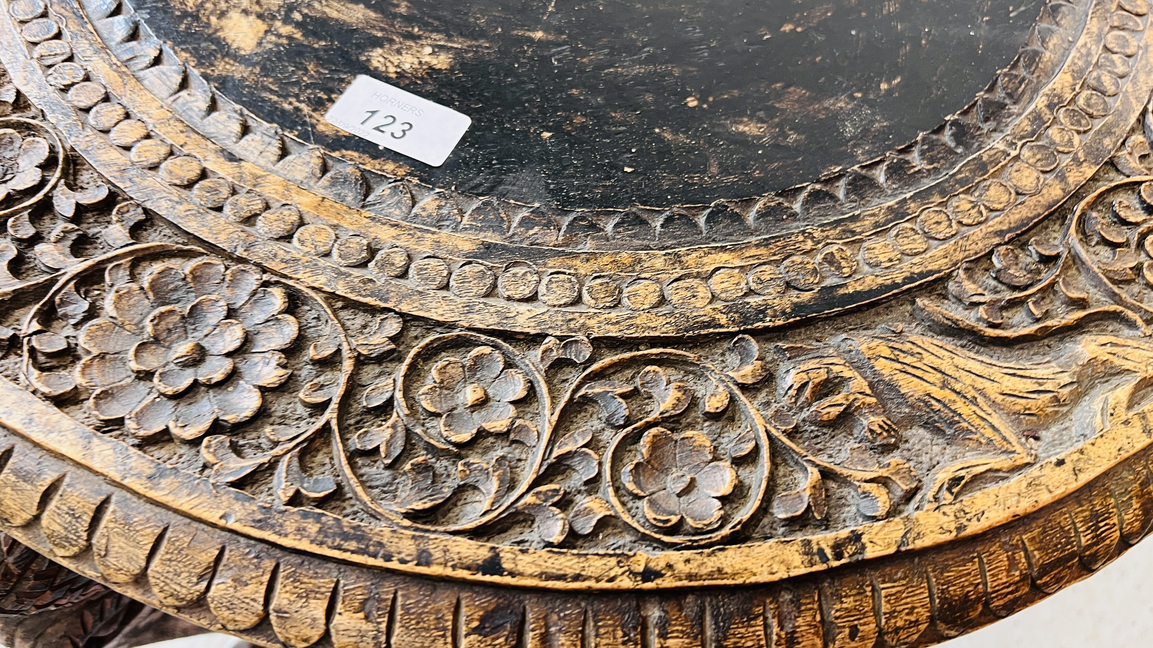 A HARDWOOD CARVED EASTERN CIRCULAR TABLE WITH ELEPHANT HEAD DETAILING TO LEGS. - Image 3 of 8