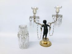 A TWO-LIGHT CANDELABRUM IN THE FORM OF A BRONZE BOY HOLDING TWO GILT METAL BRANCHES,