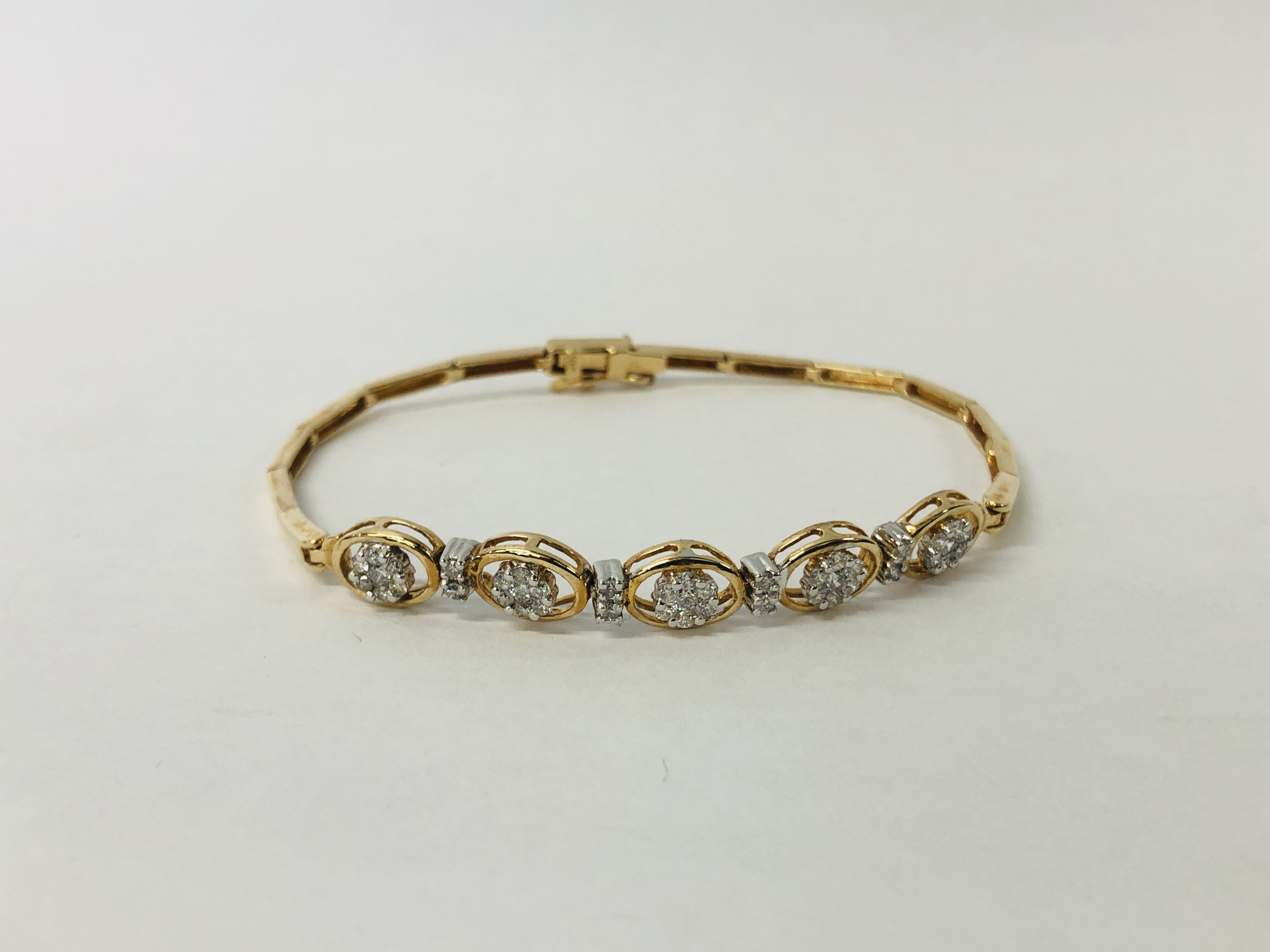 A MODERN BRACELET MARKED 585 SET WITH FORTY THREE SMALL DIAMONDS IN FLOWER HEAD SETTING ACCOMPANIED - Image 11 of 13