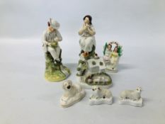 A PAIR OF STAFFORDSHIRE FIGURES A SEATED GIRL AND BOY (FOOT A/F HAIRLINE CRACK TO KNEE) EXTENSIVE