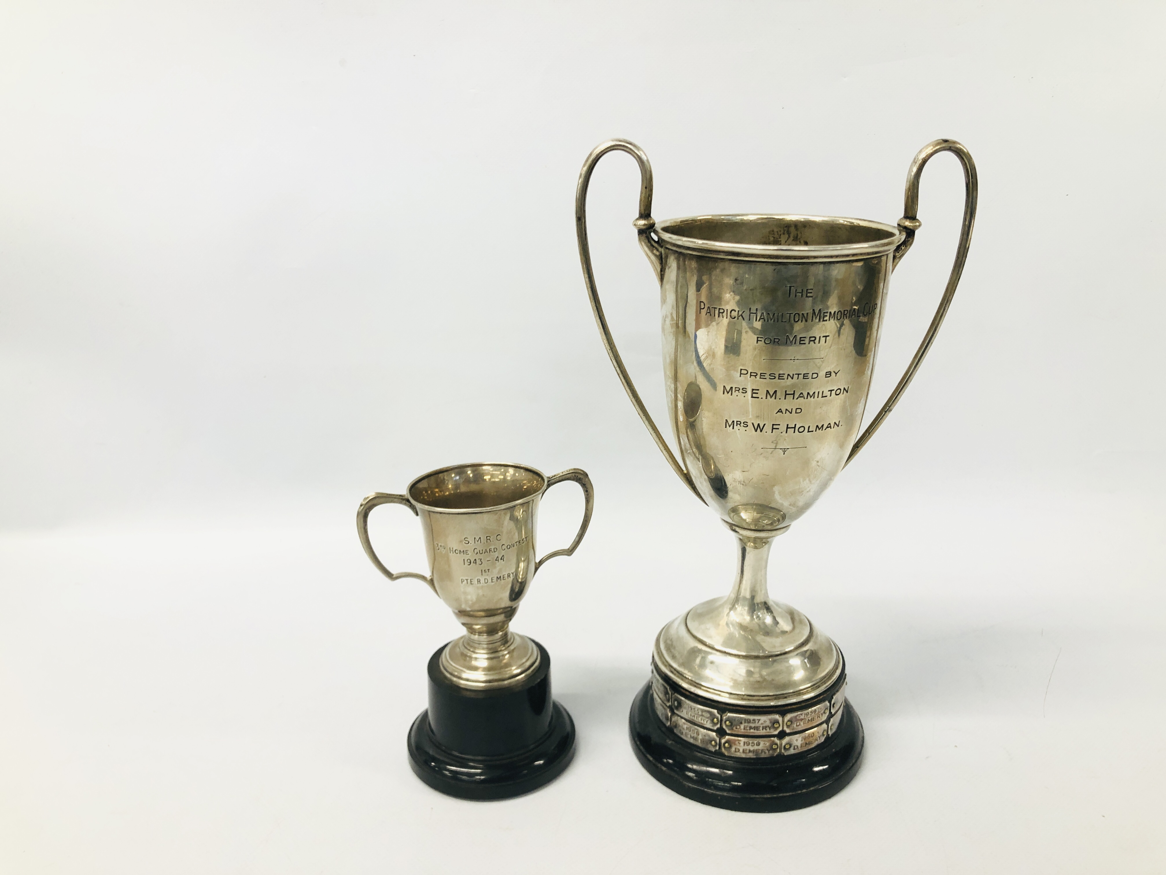 AN ANTIQUE TWO HANDLED SILVER PRESENTATION CUP BEARING INSCRIPTION RELATING TO THE PLATOON
