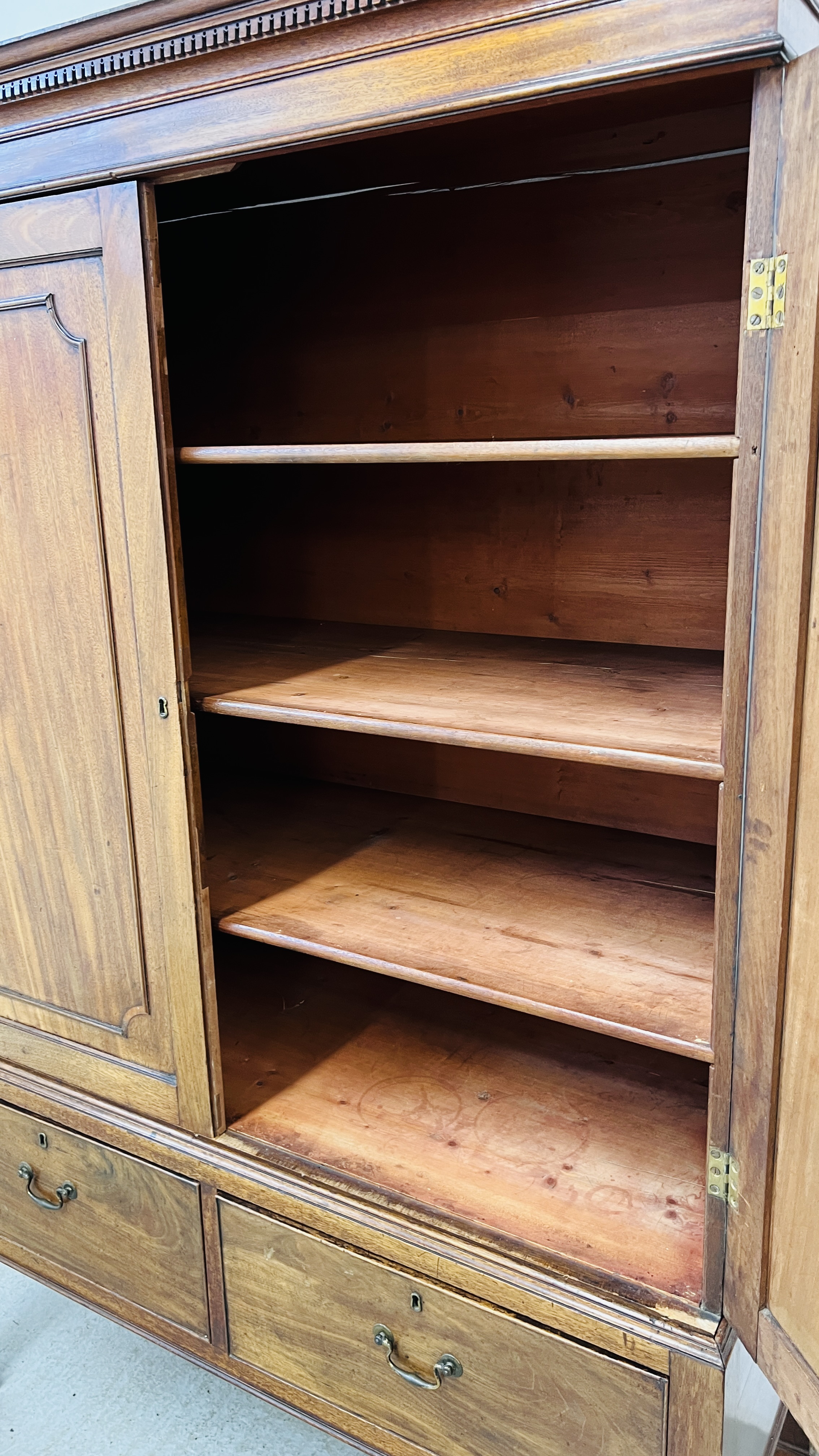 AN ANTIQUE VICTORIAN MAHOGANY TWO DOOR MAID'S CUPBOARD WITH SHELVED INTERIOR ON TWO DRAWER RAISED - Image 10 of 11