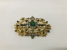 DESIGNER GILT BROOCH SET WITH CENTRAL GREEN STONE AND MULTIPLE CLEAR STONES, MARKED "ART JOY".