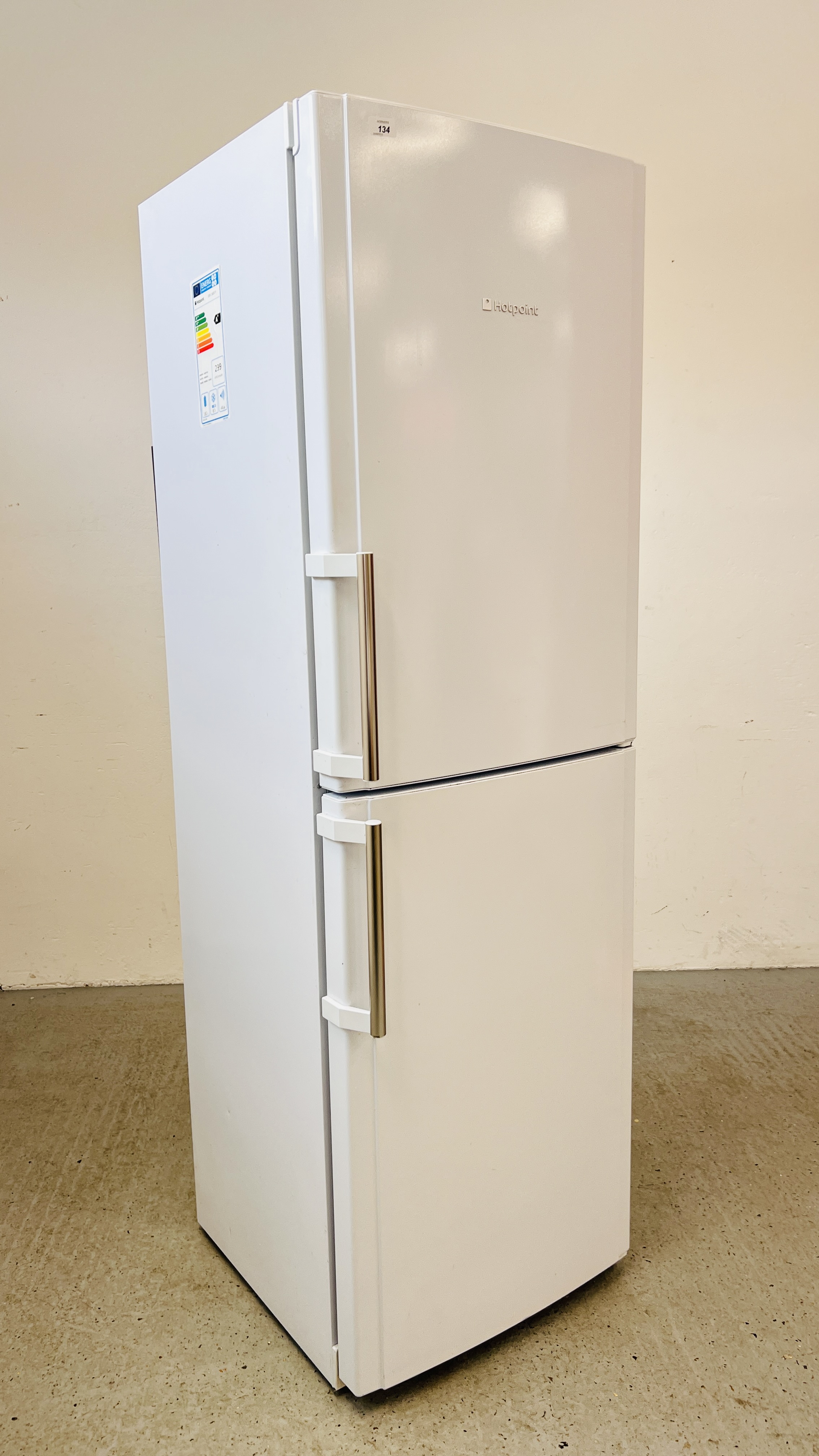 A HOTPOINT FRIDGE FREEZER WITH STAINLESS FINISH HANDLES - SOLD AS SEEN