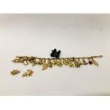 A 9CT. GOLD CHARM BRACELET WITH NINETEEN CHARMS ATTACHED (SIXTEEN 9CT.