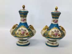 A PAIR OF C19TH SÉVRES COVERED VASES WITH RAM'S HEAD HANDLES, DECORATED WITH OVAL PANELS,