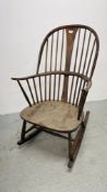 AN ANTIQUE STICK BACK ROCKING CHAIR