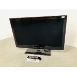 A SAMSUNG 40 INCH FLAT SCREEN TELEVISION COMPLETE WITH REMOTE AND MANUAL - SOLD AS SEEN