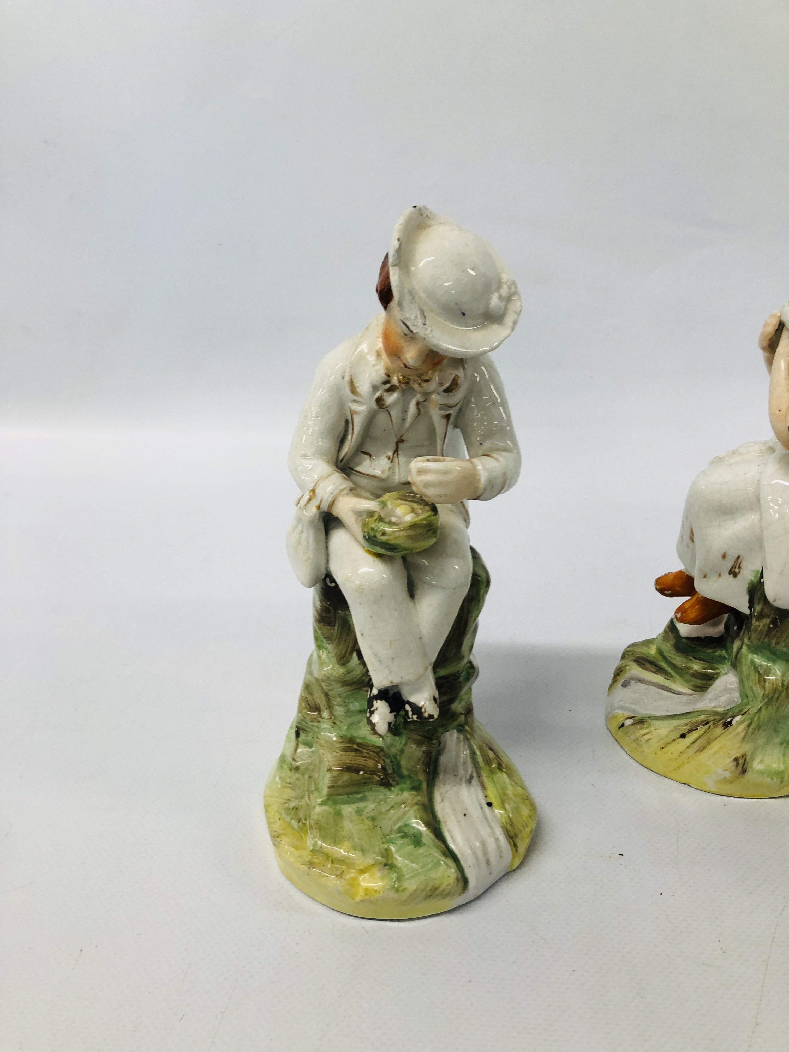 A PAIR OF STAFFORDSHIRE FIGURES A SEATED GIRL AND BOY (FOOT A/F HAIRLINE CRACK TO KNEE) EXTENSIVE - Image 11 of 14