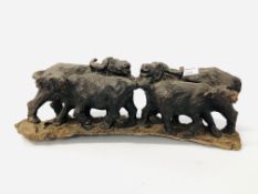 A HARDWOOD HAND CARVED STUDY OF WATER BUFFALO.