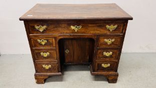 A GEORGE II WALNUT KNEEHOLE DESK OF TYPICAL FORM WIDTH 86CM. DEPTH 48.5CM. HEIGHT 71CM.