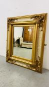 A DECORATIVE GILT FRAMED AND CRACKLE FINISH WALL MIRROR WITH BEVELLED EDGE