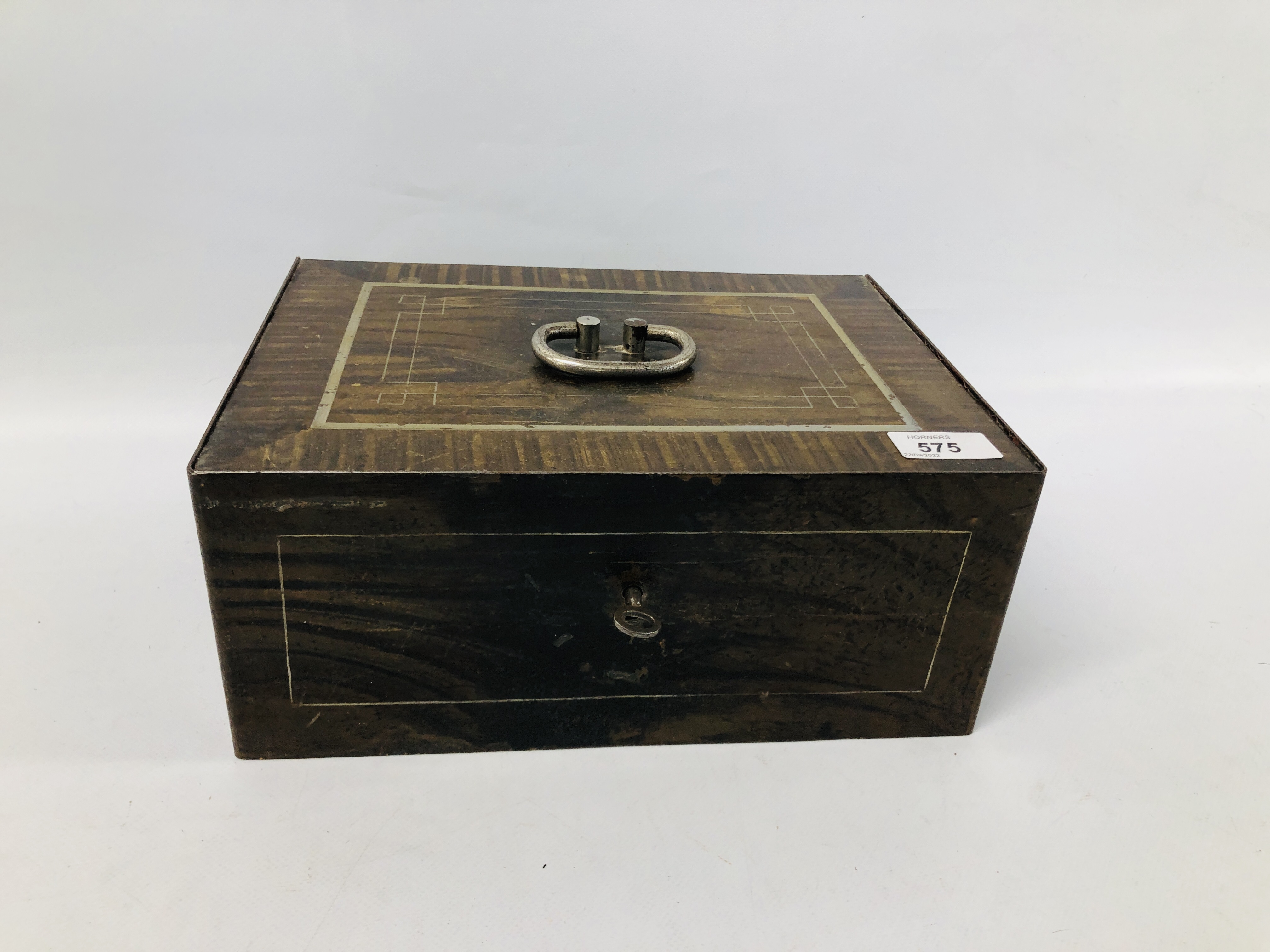 AN ANTIQUE METAL SAFE BOX COMPLETE WITH KEY WIDTH 30CM. DEPTH 23CM. HEIGHT 12CM.