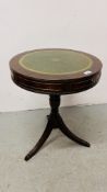 A REPRODUCTION MAHOGANY DRUM TABLE ON OUTSWEPT REEDED TRIPOD BASE HEIGHT 64CM.