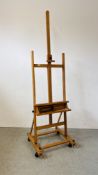 A WINDSOR AND NEWTON LARGE ARTISTS EASEL WITH ADJUSTABLE SHELF AND REVOLVING STOOL