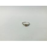 DESIGNER RING SET WITH CENTRAL ROUND CUT DIAMOND,