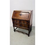 AN OAK TWO DRAWER BUREAU ON BARLEY TWIST LEG WIDTH 76CM. DEPTH 42CM. HEIGHT 100CM.