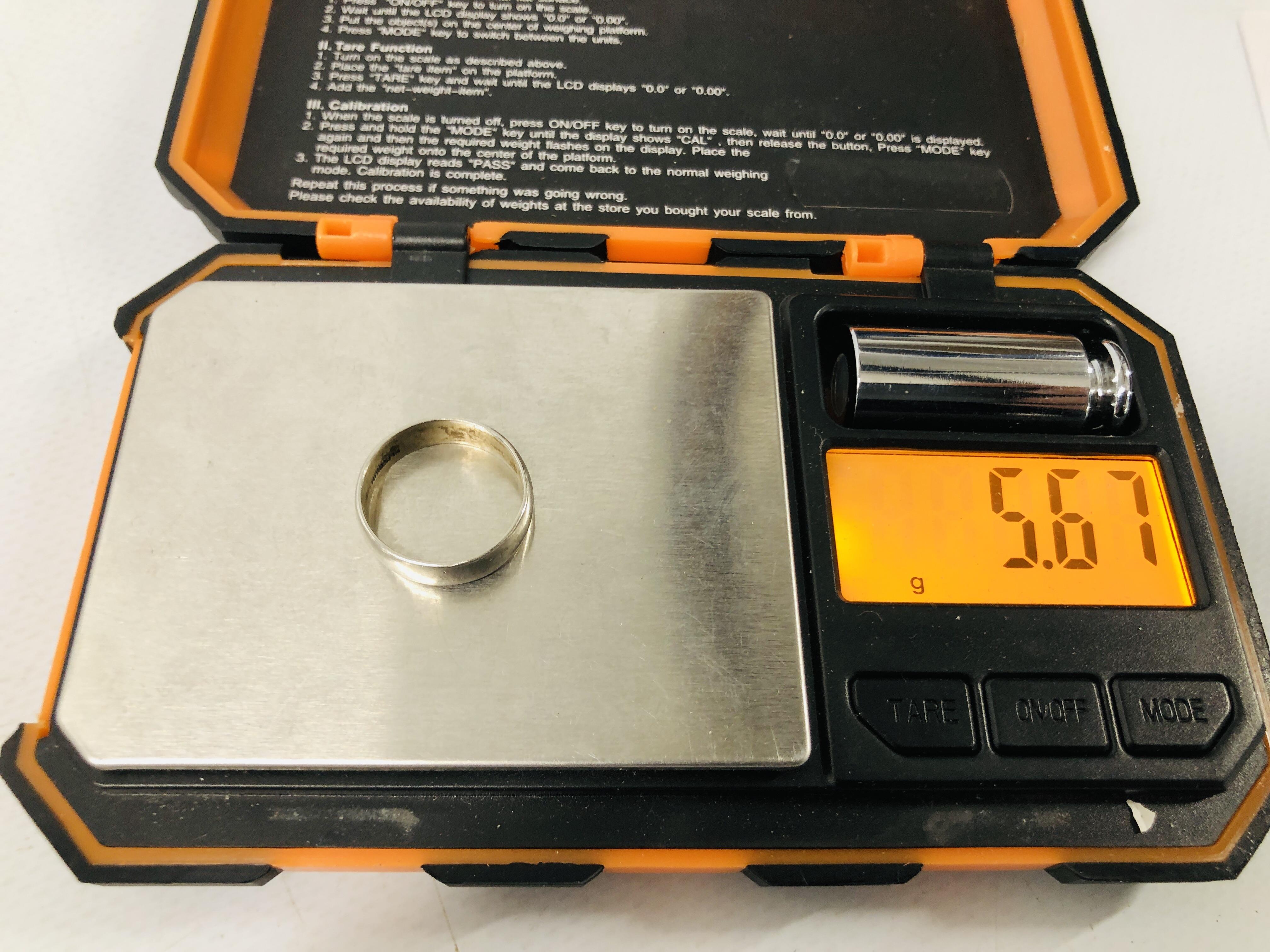 A WEDDING BAND MARKED PLATINUM. - Image 5 of 6