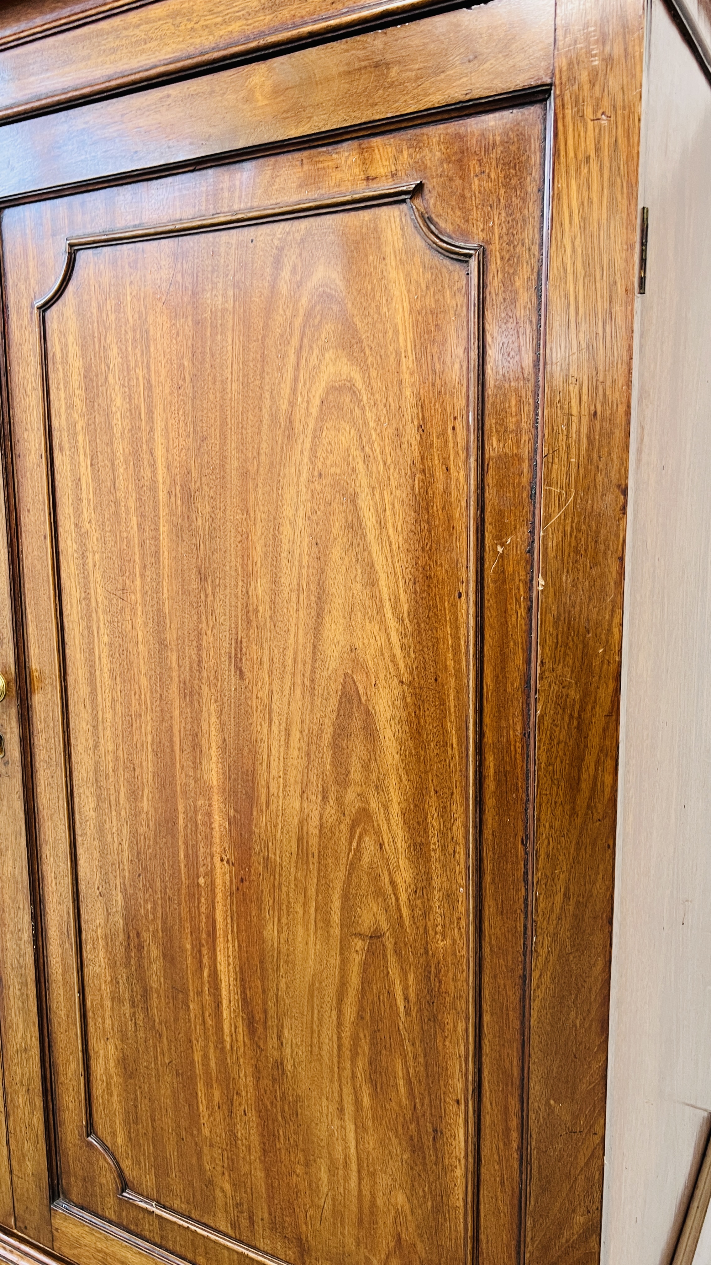 AN ANTIQUE VICTORIAN MAHOGANY TWO DOOR MAID'S CUPBOARD WITH SHELVED INTERIOR ON TWO DRAWER RAISED - Image 8 of 11