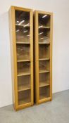 A PAIR OF MODERN FULL HEIGHT TOWER DISPLAY CABINETS OAK FINISH EACH WIDTH 40CM. DEPTH 31CM.