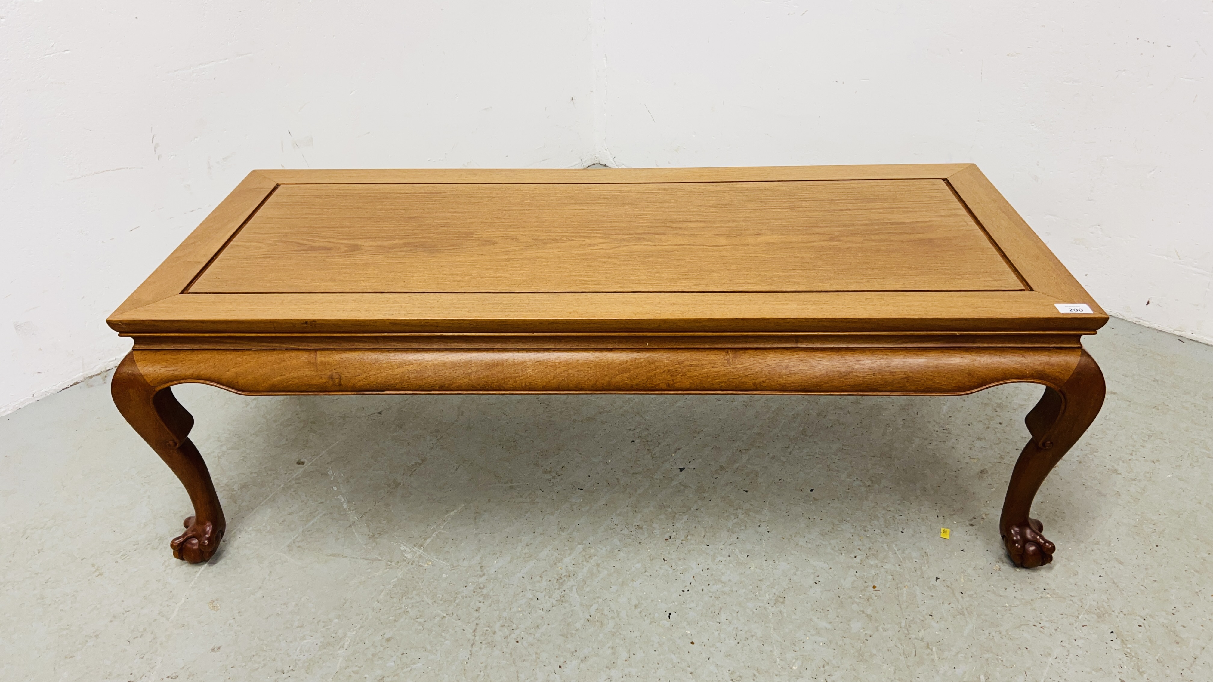 REPRODUCTION ORIENTAL HARDWOOD TABLE ON BALL AND CLAW FEET L 122CM, D 51CM, H 41CM.