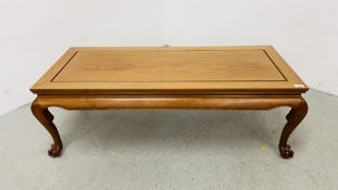 REPRODUCTION ORIENTAL HARDWOOD TABLE ON BALL AND CLAW FEET L 122CM, D 51CM, H 41CM.