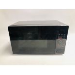 A BLACK FINISH MICROWAVE - SOLD AS SEEN