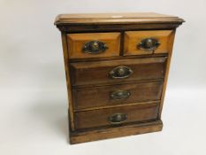 A VINTAGE TWO OVER THREE MINIATURE SET OF DRAWERS WITH BRASS LION HEAD EMBOSSED HANDLES WIDTH 36CM.