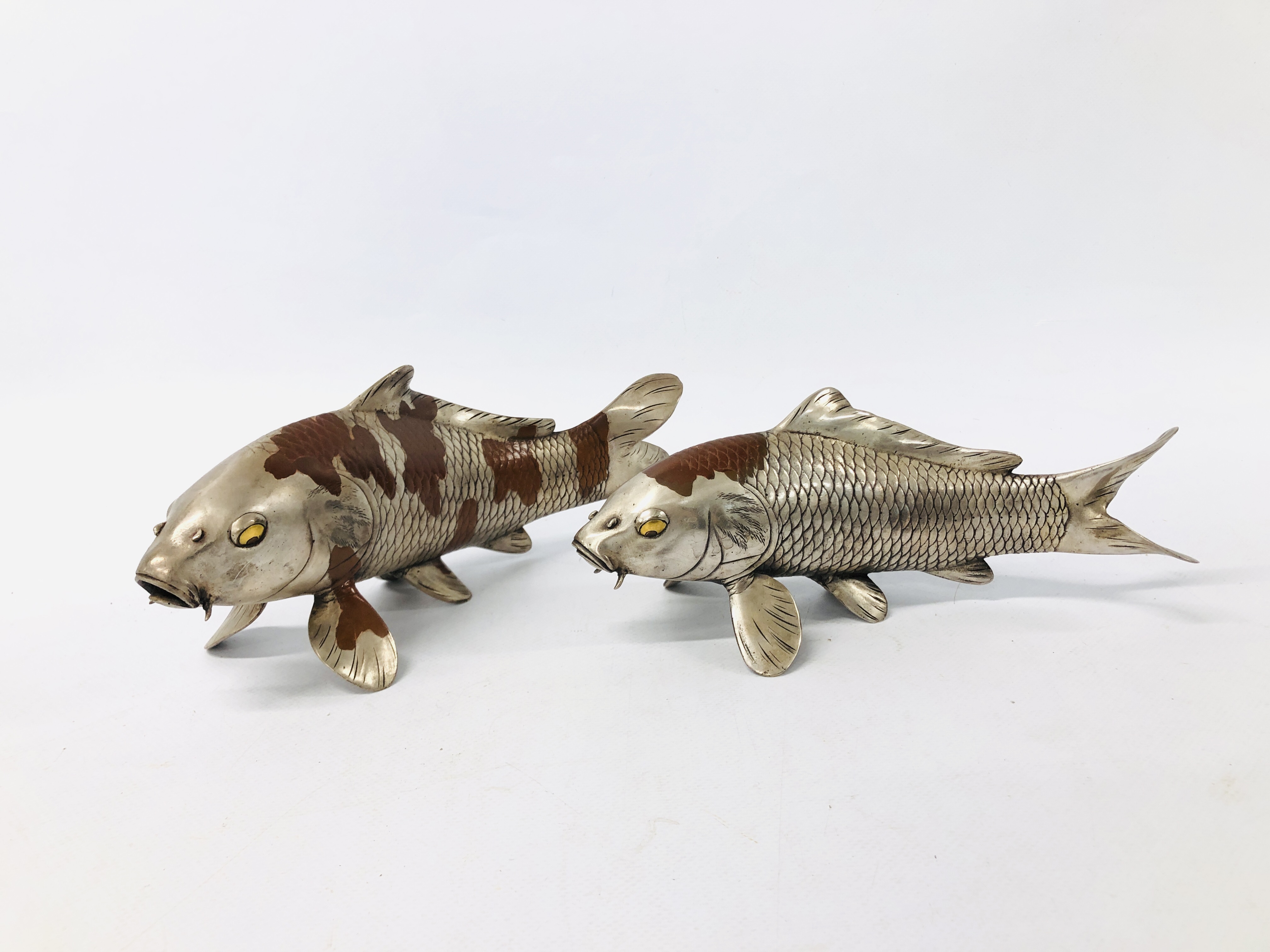 PAIR OF JAPANESE SILVERED AND PATINATED BRONZE KOI CARP NATURALISTICALLY CAST WITH GILT DETAIL TO