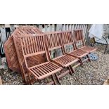 AN OCTAGONAL TEAK GARDEN TABLE COMPLETE WIT A SET OF 4 MATCHING CHAIRS,