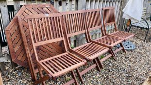 AN OCTAGONAL TEAK GARDEN TABLE COMPLETE WIT A SET OF 4 MATCHING CHAIRS,