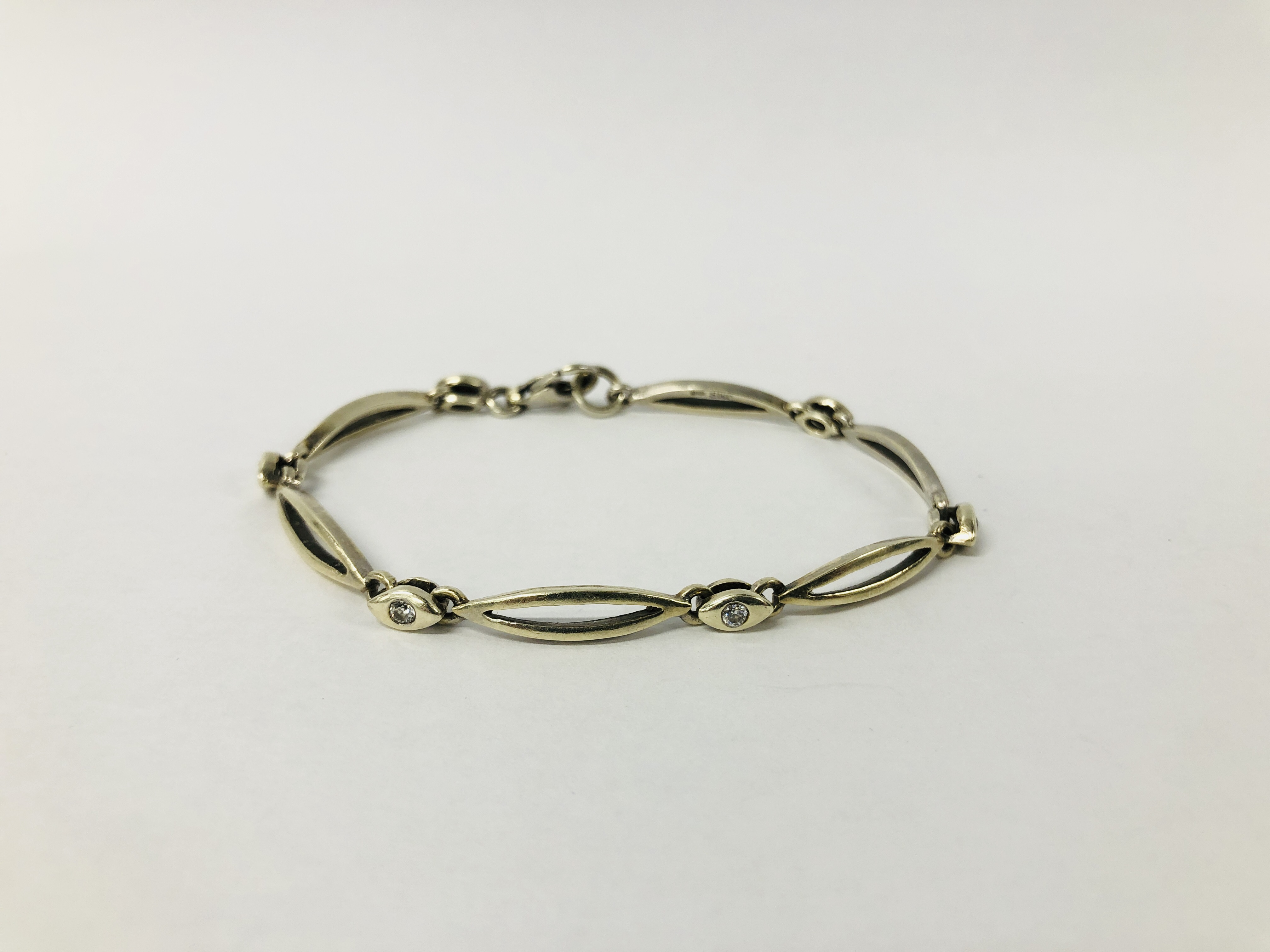 A DESIGNER BRACELET MARKED 375,