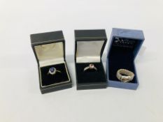 TWO DRESS RINGS MARKED 925 ALONG WITH ONE FURTHER GOLD TONE RING.