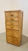 AN ANTIQUE WAXED PINE SIX DRAWER TOWER CHEST W 57CM, D 44CM, H 123CM.