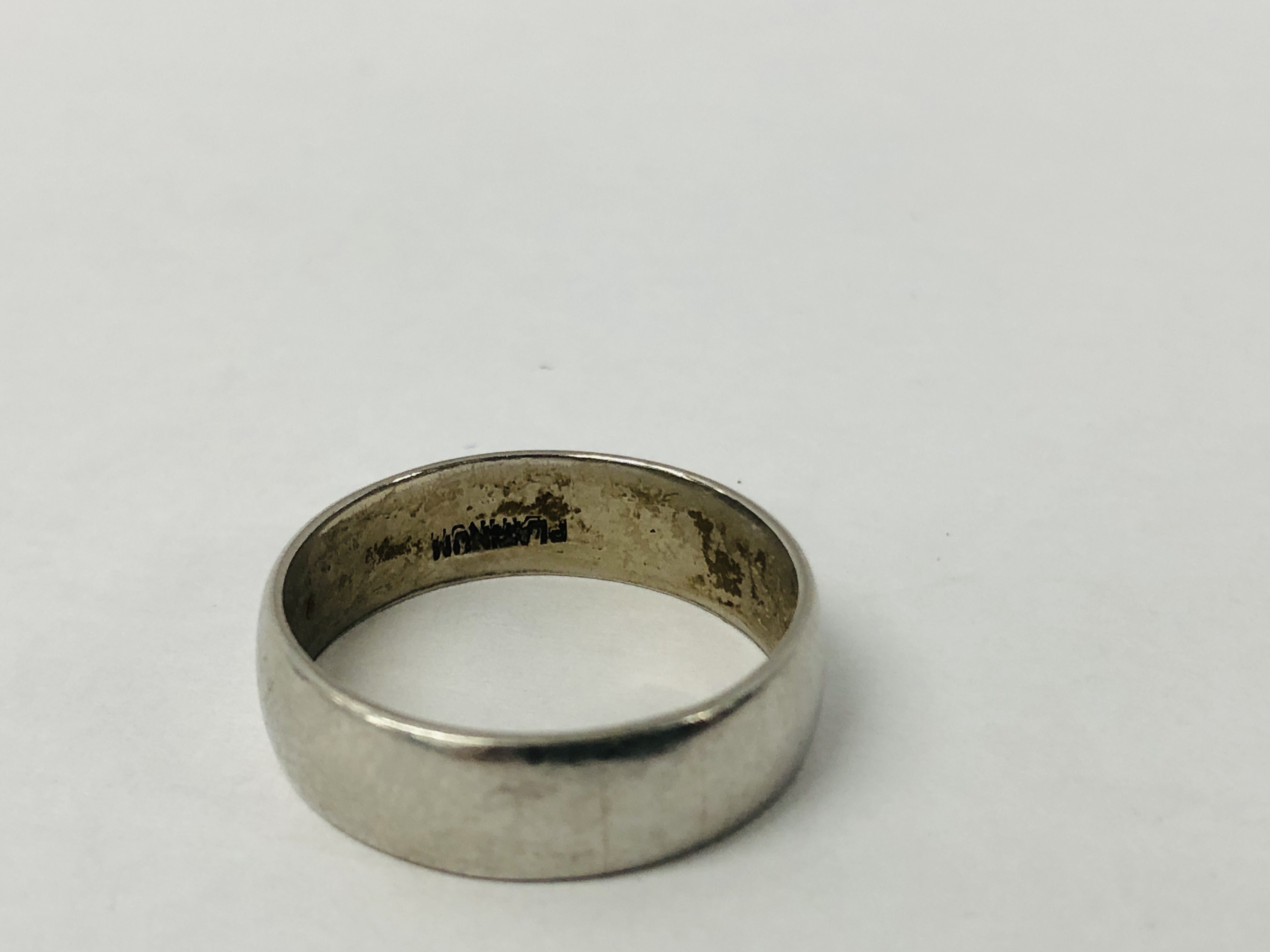 A WEDDING BAND MARKED PLATINUM. - Image 4 of 6