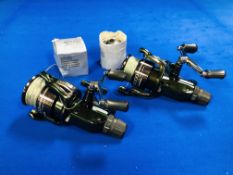 A PAIR OF BAIT RUNNER XT 10000 RA FISHING REELS WITH SPARE SPOOLS