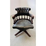 A REPRODUCTION BOTTLE GREEN LEATHER BUTTON BACK REVOLVING OFFICE CHAIR - REQUIRES REPLACEMENT