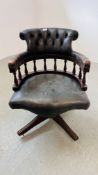 A REPRODUCTION BOTTLE GREEN LEATHER BUTTON BACK REVOLVING OFFICE CHAIR - REQUIRES REPLACEMENT