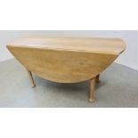 A SOLID LIMED OAK DROP FLAP DINING TABLE WITH OVAL TOP STANDING ON PAD FOOT WIDTH 168CM. X 62CM.