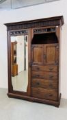 AN ANTIQUE OAK ARTS AND CRAFTS CHIFFEROBE WITH SINGLE MIRRORED DOOR,