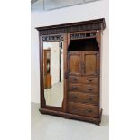 AN ANTIQUE OAK ARTS AND CRAFTS CHIFFEROBE WITH SINGLE MIRRORED DOOR,