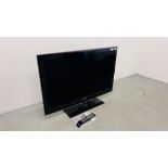 A SAMSUNG 40 INCH FLAT SCREEN TELEVISION COMPLETE WITH REMOTE AND MANUAL - SOLD AS SEEN