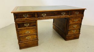 A REPRODUCTION "PARTNERS STYLE" TWIN PEDESTAL DESK WITH TOOLED INSET GREEN LEATHER TO TOP,