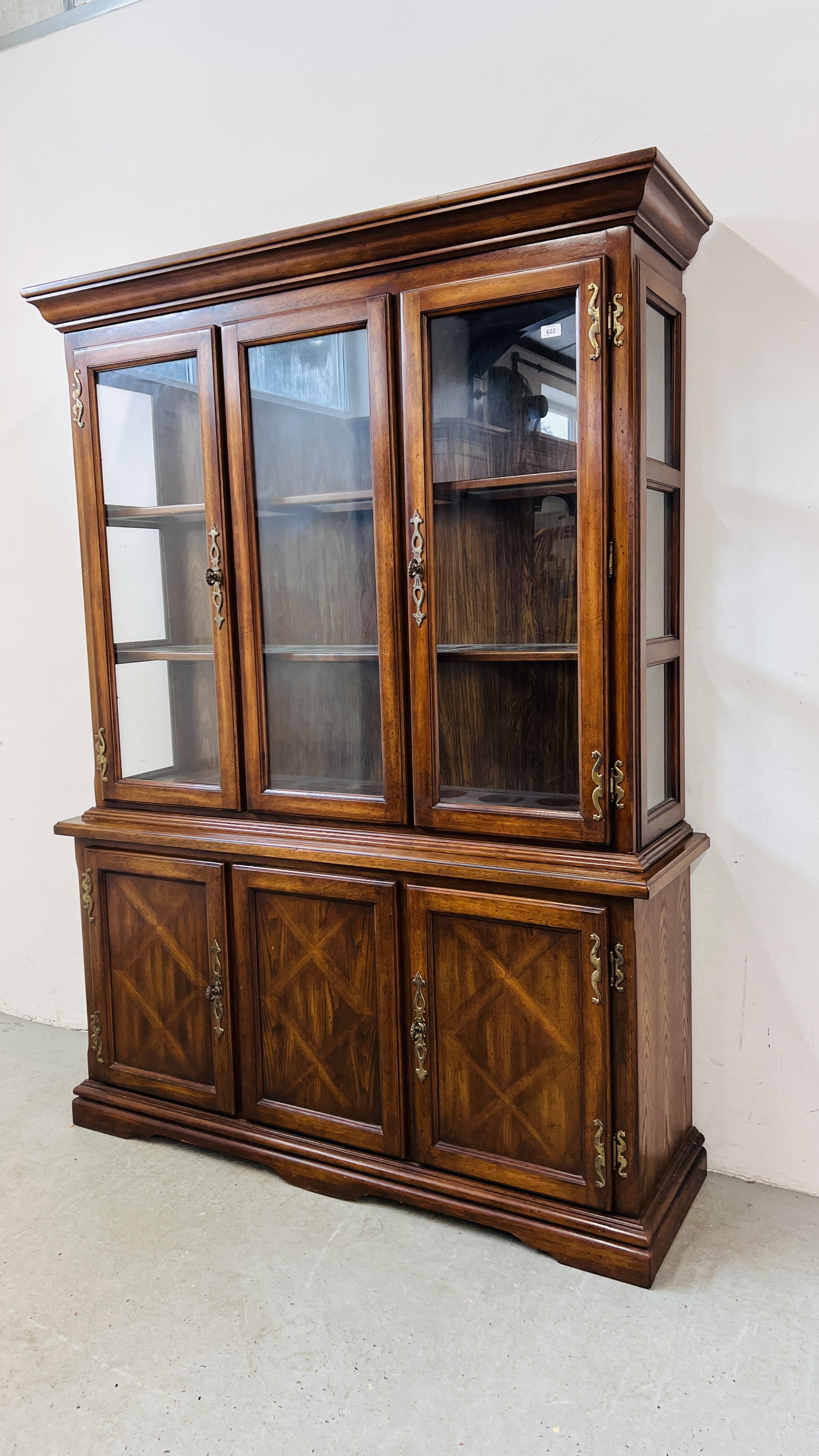 A REPRODUCTION ANTIQUE FINISH DISPLAY CABINET WITH THREE DOOR CABINET BASE W 149CM, D 43CM, H 202CM.