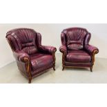 A PAIR OF GOOD QUALITY MODERN OXBLOOD LEATHER UPHOLSTERED EASY CHAIRS.