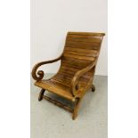 A REPRODUCTION TEAK WOOD SCROLL BACK PLANTATION CHAIR